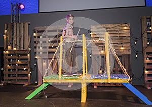 Eleven year old boy in scouting uniform crossing the bridge, Arrow of Light Ceremony