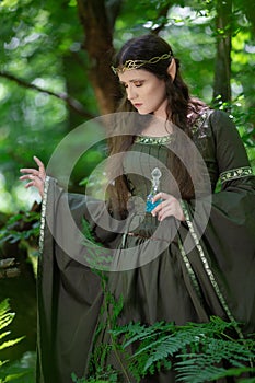 Elf with a bottle of magic potion