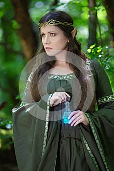 Elf with a bottle of magic potion