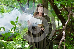 Elf performing spells in the forest