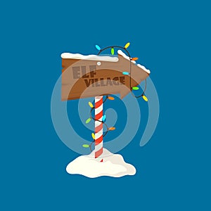 Elf Village Christmas Signboard, Wooden Sign with Snow and Garlands. Wood Banner, Road Direction Arrow on Striped Pole