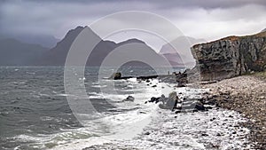 Elgol beach at Port na Cullaidh with Red Cuillin Mountains under clouds on Loch Scavaig Scottish Highlands Isle of Skye