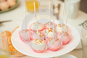 elicious and mouth watering lollypop pastry arranged in dish.
