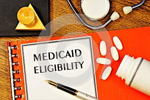 Eligibility for Medicaid - text inscription on the form on the medical folder.