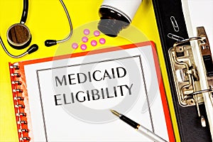 Eligibility for Medicaid - text inscription on the form on the medical folder.