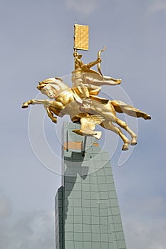 ELISTA, RUSSIA. A monument `The gold rider` against the background of the sky