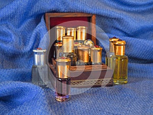 Arabian oud attar perfume or agarwood oil fragrances in mini bottles. photo