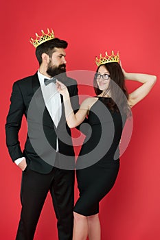 Elite society. Being recognised and proud. Proud couple. Woman and bearded man wear crowns. Selfish egoist. Superiority photo