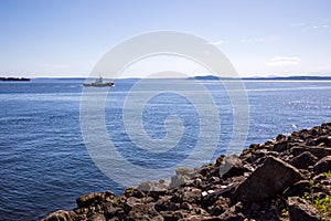 Elliott Bay and rock seashore at Seattle Centennial Park during summer