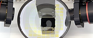 Ellipsometer tool in a laboratory. Silicon wafer with cells measure thickness of film on ellipsometer.Banner.