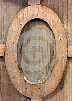 A elliptic type wooden frame on wood wall