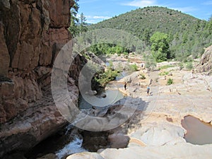 Ellison Creek waterfall in Arizona with people below