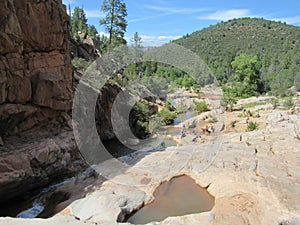 Ellison Creek waterfall in Arizona with people below photo