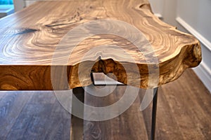 Live edge elm slab coffee table. Woodworking and carpentry production. Furniture manufacture