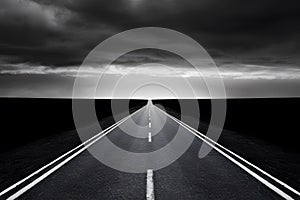 Elongated road with open landscape, dark clouds, and bright light, creating dramatic contrast