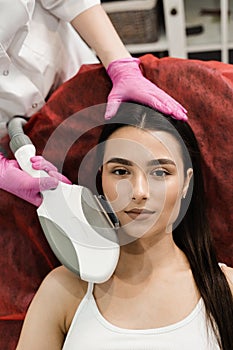 ELOS rejuvenation procedure for young girl for non-surgical facelift effect. ELOS treats loose, wrinkled or rough skin