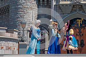 Elsa, Anna and Minnie on Mickey`s Royal Friendship Faire on Cinderella Castle in Magic Kingdom .