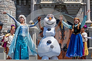 Elsa, Anna and Olaf on Mickey`s Royal Friendship Faire on Cinderella Castle in Magic Kingdom .