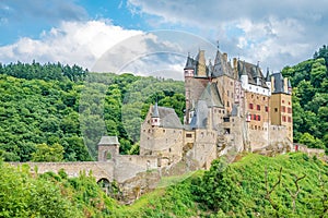 Eltz Castle, a medieval castle located on a hill in the forest