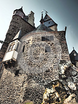 Eltz Castle is a medieval castle nestled in the hills above the Moselle River between Koblenz and Trier