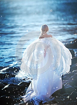 Elven girl with star on sea coast