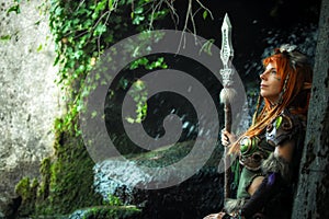 Elven warrior woman in the deep forest