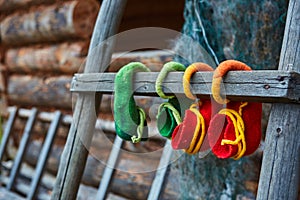 The elves hung their felt shoes on the old wooden ladder to dry