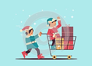 elves preparing for new year and christmas holidays celebration santa helpers pushing trolley cart with gifts