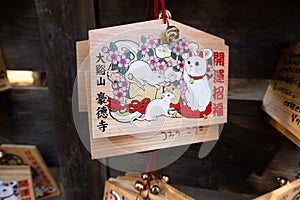 Ema wooden tablets with wishes in Gotokuji Temple Tokyo, Japan