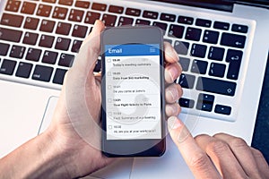 Email app on smartphone screen with business person reading messages from inbox with wireless internet access on mobile phone,