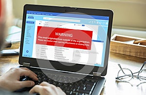 Email attachments warning message on a laptop screen. Computer Virus and Antivirus
