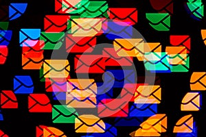 Email concept. Many colorful envelopes abstract bokeh lights background