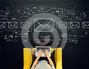 Email concept with person using a laptop