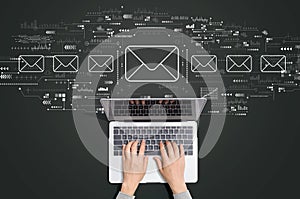 Email concept with person using laptop