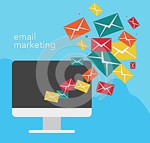 Email marketing concept with a computer and flying letters from it.