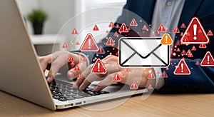 email spam and malware warning on laptop