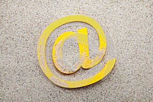 Email symbol in the sand