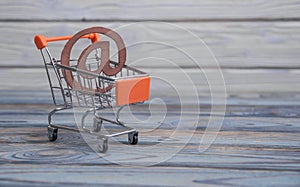 An email symbol, shopping cart