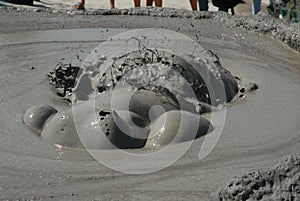 emanations of gases, water and mud with power making bubbles photo