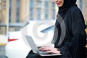 Emarati Arab Business woman using laptop computer