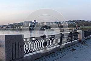 The embankment of the Angara in the evening with a view of the c