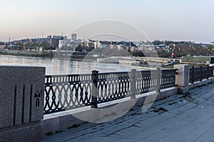 The embankment of the Angara in the evening with a view of the c