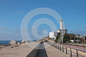 Embankment and beacon on sea coast. Ibiza, Spain