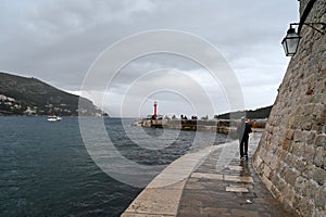 Embankment of the entrance to the old port of Dubrovnik on a cloudy day