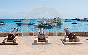 Embankment with guns in Zanzibar Stone Town with ocean on the ba photo