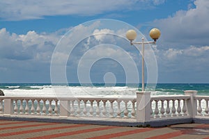 Embankment of the resort city of Gelendzhik. balustrade and lights of the embankment against the background of storm waves