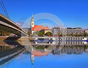 Embankment, St. Martin Cathedral and reflection in the water, Bratislava, Slovakia. Reflection in water