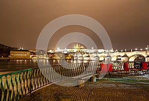 Embankment of the Vltava River near Charles Bridge, night. Prague. Czech Republic