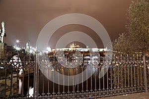 Embankment of the Vltava River near Charles Bridge, night. Prague. Czech Republic