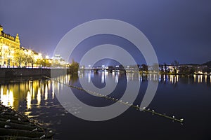 Embankment of the Vltava River near Charles Bridge, night. Prague. Czech Republic